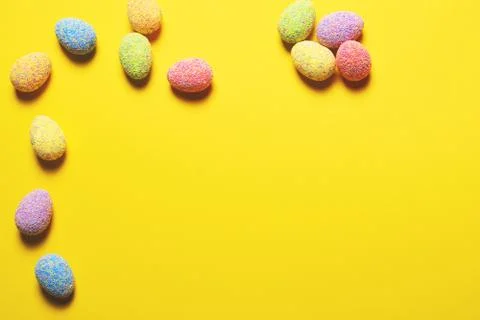Colorful easter eggs on yellow background. Stock Photos