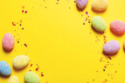 Colorful easter eggs on yellow background. Stock Photos