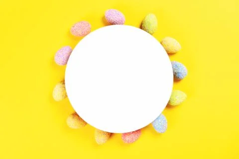 Colorful easter eggs on yellow background. Stock Photos