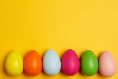 Colorful Easter eggs on a yellow background Stock Photos