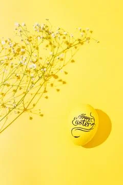 Colorful easter eggs on a yellow background hard light black shadows Stock Photos