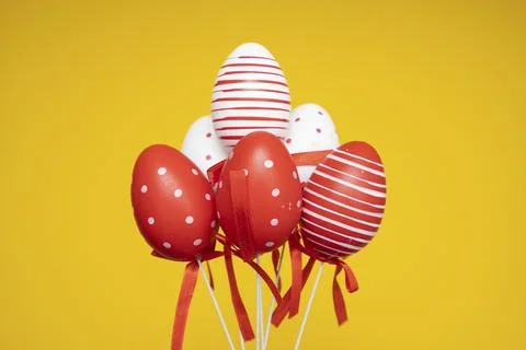 Colorful Easter eggs on yellow background Stock Photos