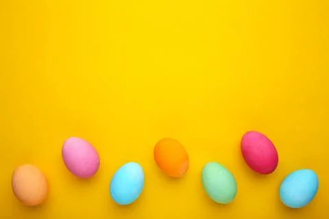 Colorful easter eggs on a yellow background Stock Photos