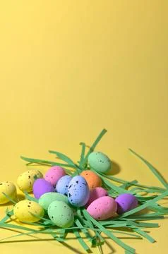 Colorful Easter Eggs on Yellow Background with Paper Grass Minimal Spring H.. 스톡 사진