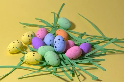 Colorful Easter Eggs on Yellow Background with Paper Grass Minimal Spring H.. Stock Photos