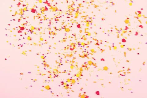 Colorful easter topping on pink background. Stock Photos