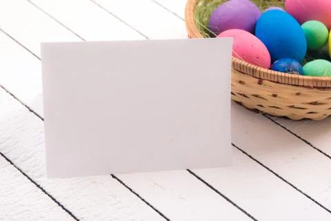 Colorful ecological styrofoam Easter eggs and blank white sheet of wood Stock Photos