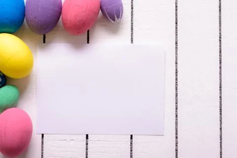 Colorful ecological styrofoam Easter eggs and blank white sheet of wood Foto stock