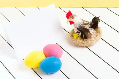 Colorful ecological styrofoam Easter eggs and chicken on a wooden background Stock Photos