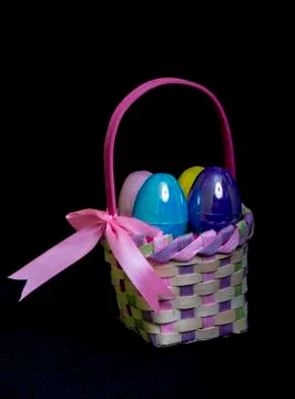 Colorful Eggs In A Easter Basket Stock Photos