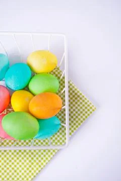 Colorful eggs for Easter day in a basket. Stock Photos