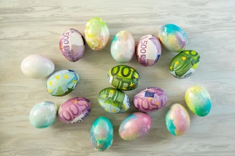 Colorful eggs for Easter decorated with euro . Stock Photos