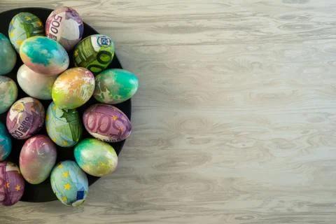 Colorful eggs for Easter decorated with euro . Stock Photos