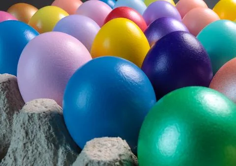 Colorful eggs in egg cartons for Easter. Stock Photos