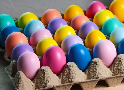 Colorful eggs in egg cartons for Easter. Stock Photos