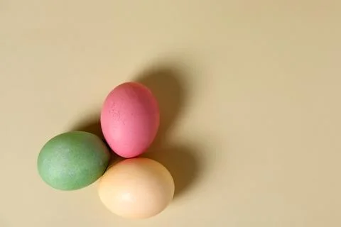 Colorful eggs placed on a flat surface during a spring celebration in a home Stock Photos