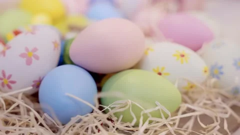 Colorful eggs in straw for spring celebration. Stock Footage 236341770