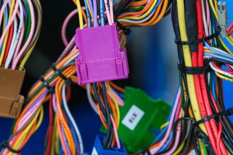 Colorful electrical wire bundle with plastic cable connector. Automotive wire Stock Photos