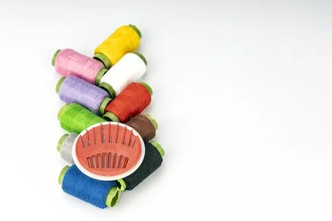 Colorful Embroidery Thread Spools with Red Needle Pincushion and Sewing Sup.. Stock Photos