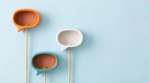Colorful empty ceramic speech bubbles on sticks showing bottom side against.. Stock Illustration