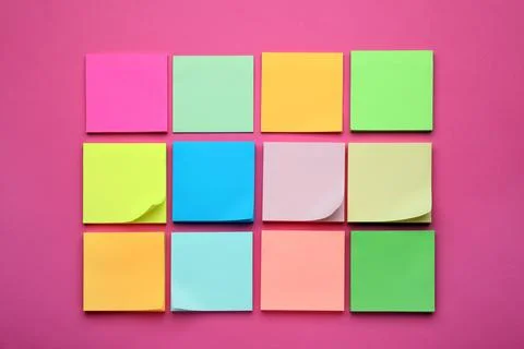 Colorful empty notes on pink background, flat lay Stock Photos
