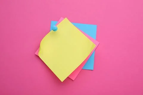 Colorful empty notes pinned on pink background Stock Photos