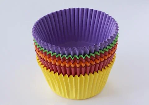 Colorful empty paper forms capsules for muffins and cupcakes on white Stock Photos