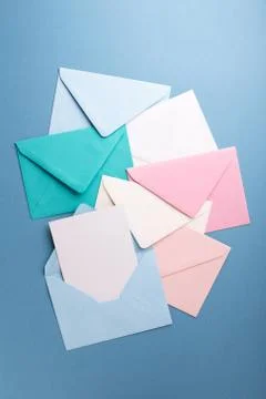Colorful envelopes on grey table. Stock Photos
