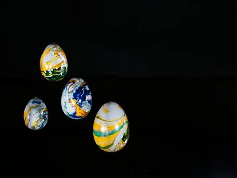 Colorful Ester eggs in a black background Stock Photos