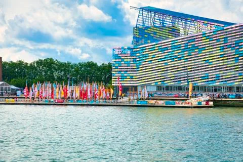 Colorful facade of a building with a vibrant rectangular window pattern. Glas Stock Photos