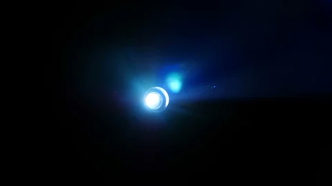 The colorful, fast-changing projector beam is clearly visible in clouds of smoke 스톡 동영상 142253503