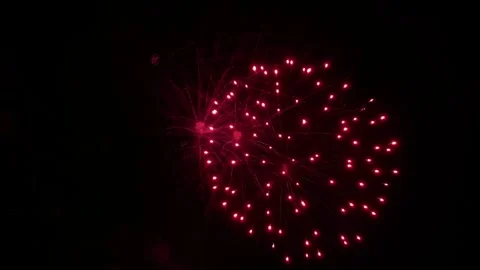 Colorful festive fireworks explode against the black sky. Stock Footage 340587612