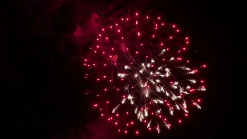 Colorful festive fireworks explode against the black sky. Stock Footage 340587622