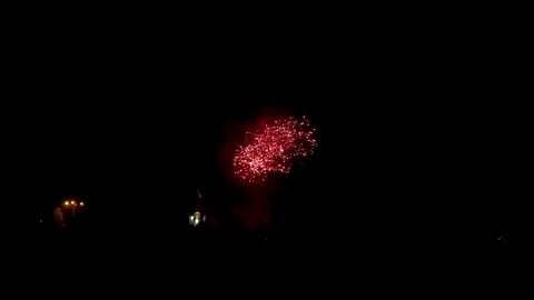 Colorful festive fireworks explode against the black sky. Stock Footage 344751254
