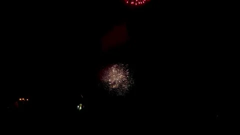 Colorful festive fireworks explode against the black sky. Stock Footage 344751255