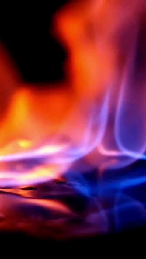 Colorful fire flames dancing on a black reflective surface Stock Footage 331991681