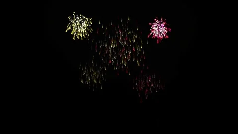 Colorful firework bursts exploding in night sky for celebration event motio.. Stockbeeldmateriaal 345169369