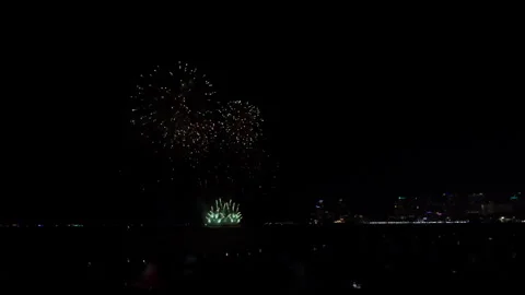 Colorful Firework Explosions Over Ocean Coastline In Pattaya Thailand Wide Sh Video stock 337999238