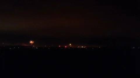 Colorful firework explotions at new years eve. Far view at the city Stock Footage 122938193