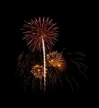 Colorful firework sparkling on black background Stock Photos