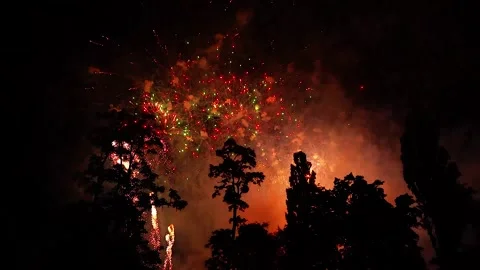 Colorful fireworks explode in air at night. Large pyrotechnic festive, bright Stock Footage 314560406