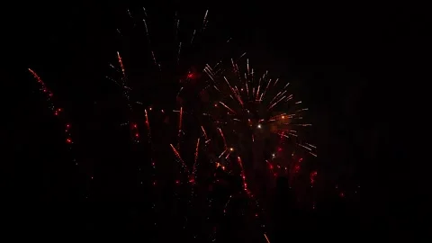Colorful fireworks explode in night sky. Festival ending with fire show Stock Footage 314560281