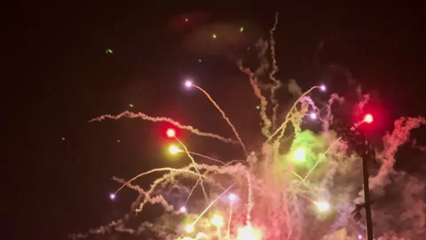 Colorful fireworks explode over baseball stadium in Georgia Stock Footage 300709714