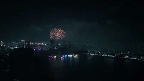 Colorful fireworks exploding above han river, painting da nang's nighttime Stock Footage 312238009