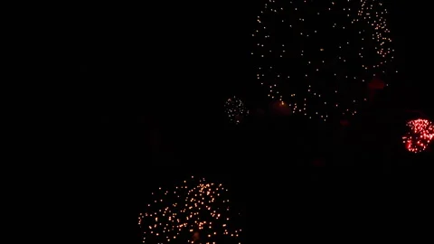 Colorful fireworks exploding in the dark night sky during celebration Stockbeeldmateriaal 337833201