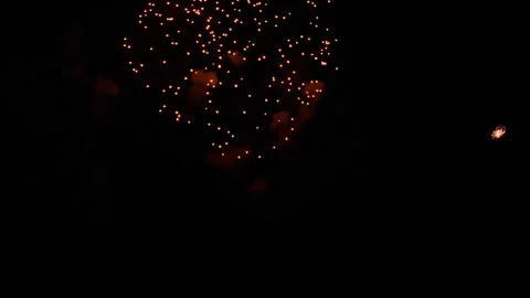 Colorful fireworks exploding in dark night sky during celebration Stock Footage 339639877
