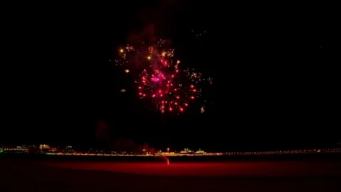 Colorful fireworks exploding late at night on the street Stock Footage 127373954