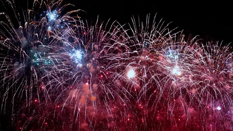Colorful fireworks exploding in the night sky. Celebrations and events in bri Stock Footage 86640882