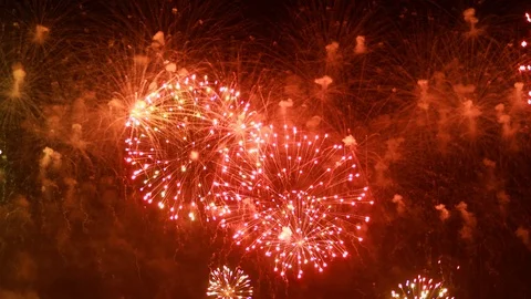 Colorful fireworks exploding in the night sky. Celebrations and events in bri Stock Footage 101737573