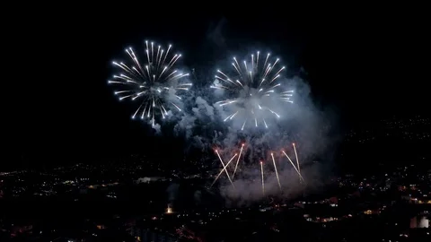 Colorful fireworks exploding in the night sky aerial view 4k Stock Footage 109220338